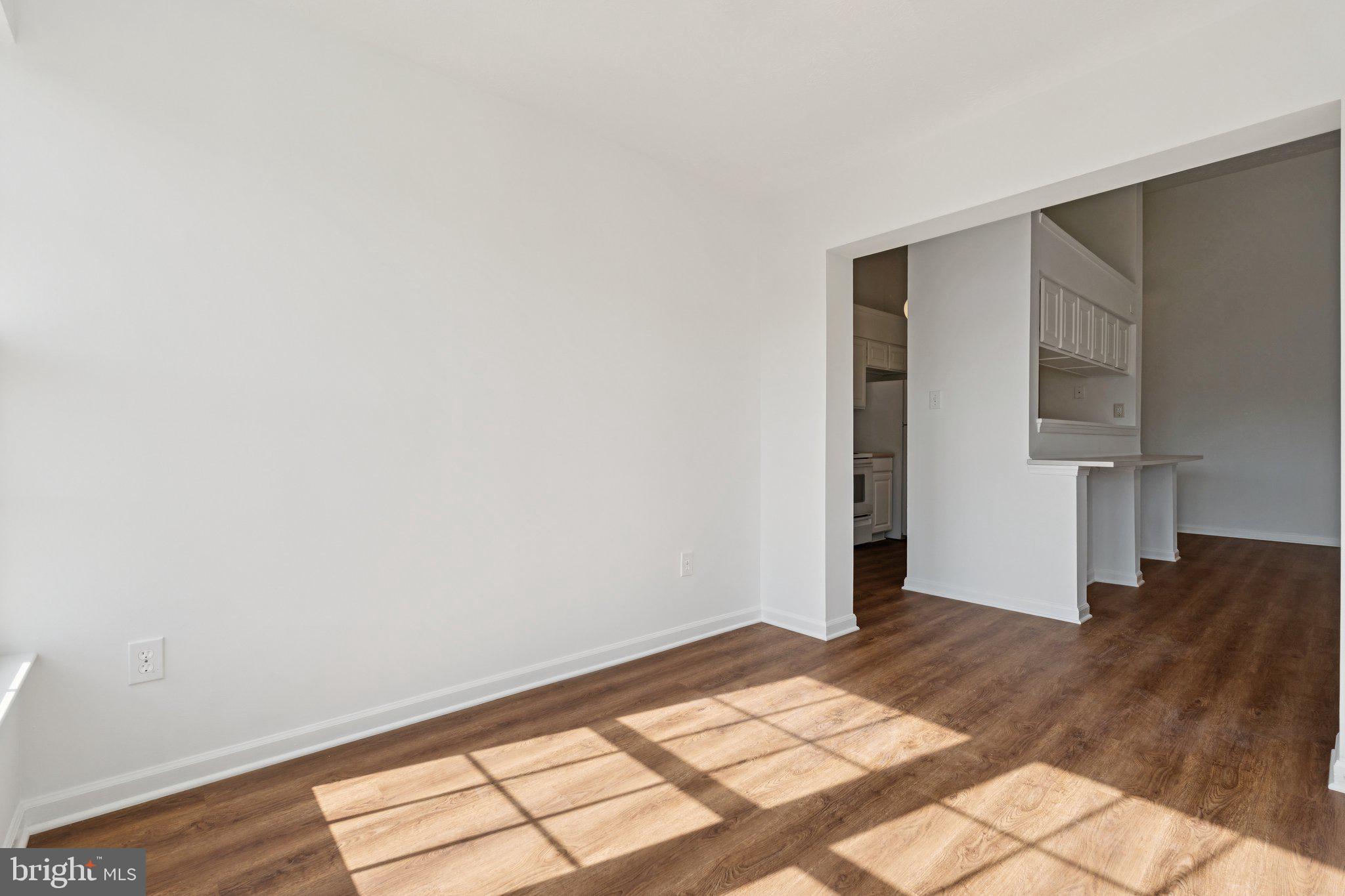 7655 Gladstone Road, Unit 5 Baltimore, MD 21244 - Photo 8 of 25 a view of a room with wooden floor and bedroom