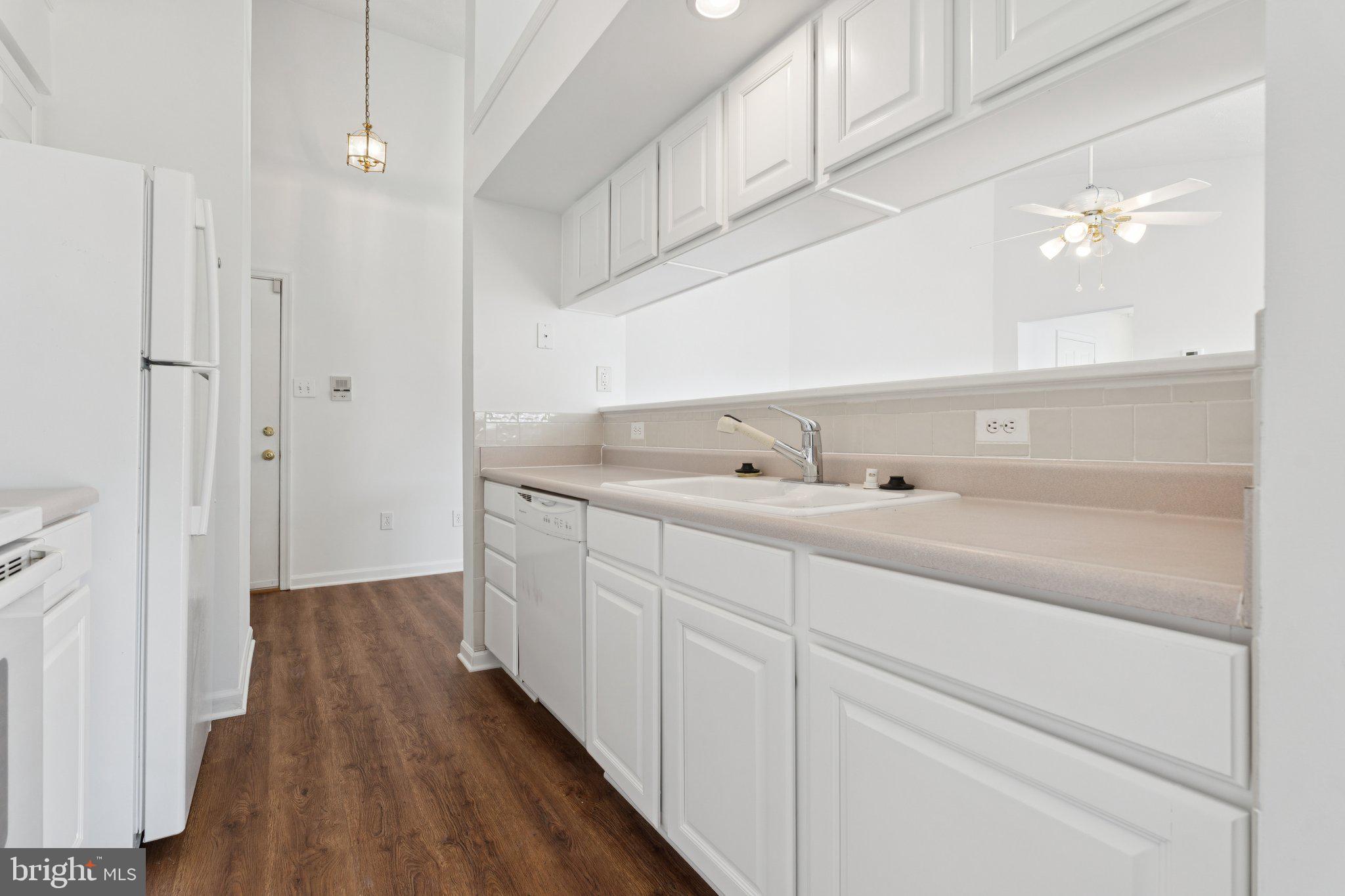 7655 Gladstone Road, Unit 5 Baltimore, MD 21244 - Photo 10 of 25 a bathroom with a sink and mirror