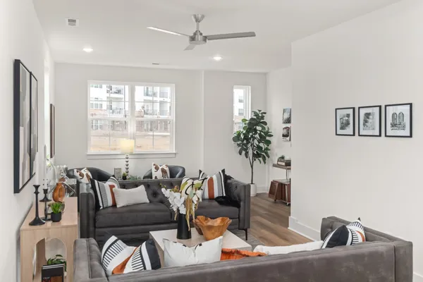 a living room with furniture and a large window