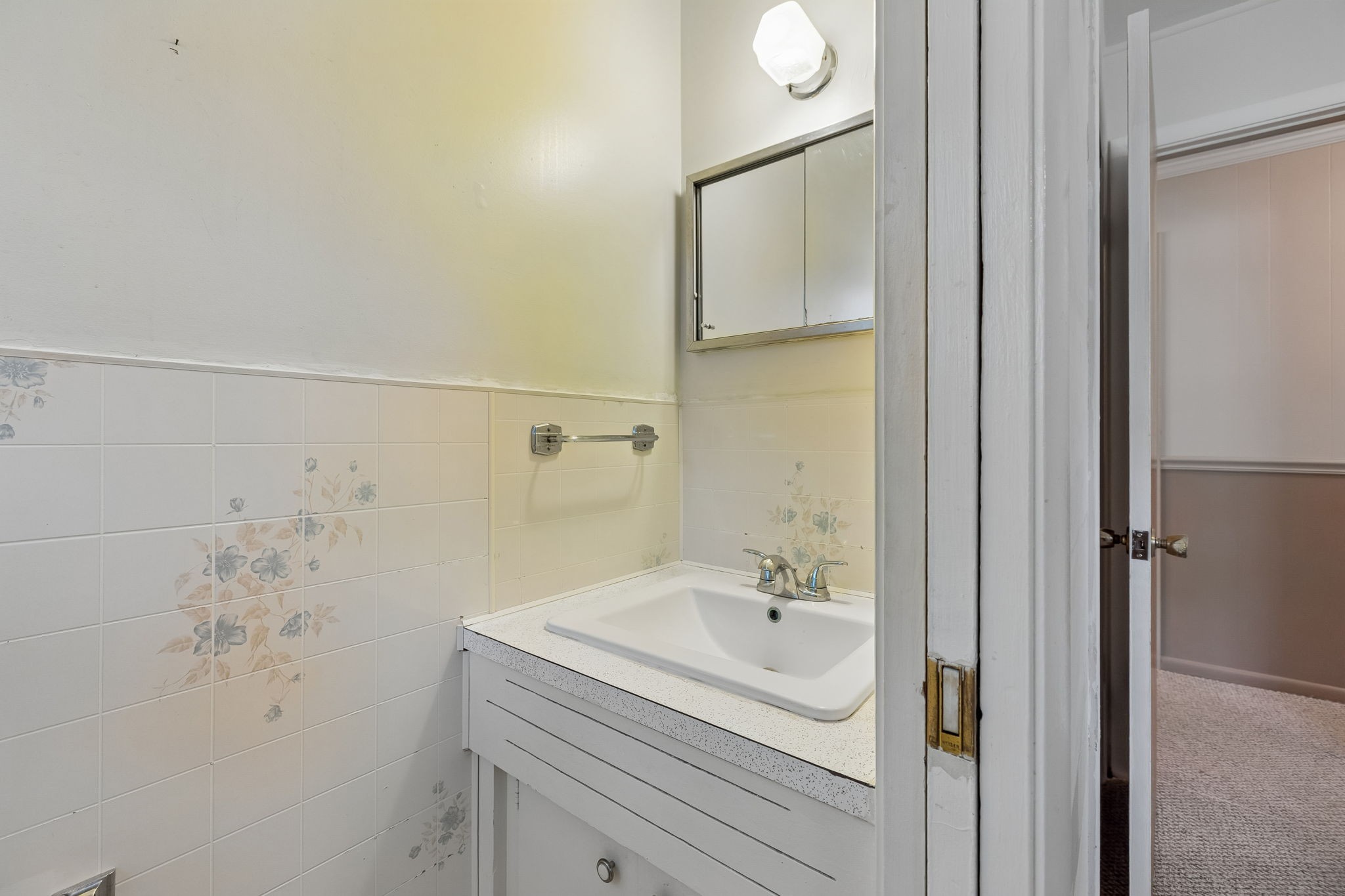 708 Hickory Street Centerville, TN 37033 - Photo 27 of 57 a bathroom with a sink and mirror