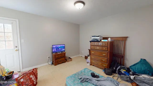 a bedroom with furniture and a bed