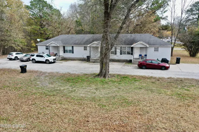a view of street with parked cars