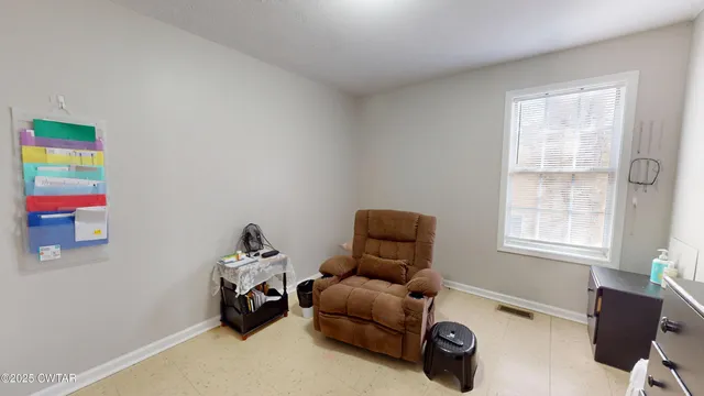 a room with furniture and a window