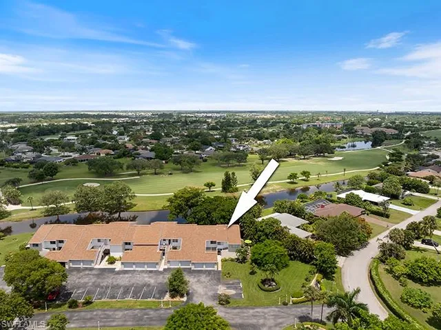 an aerial view of a city with lake view