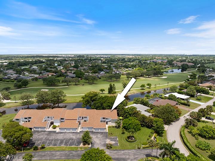 an aerial view of a city with lake view