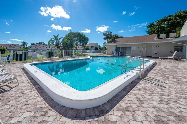 a view of a swimming pool with a patio