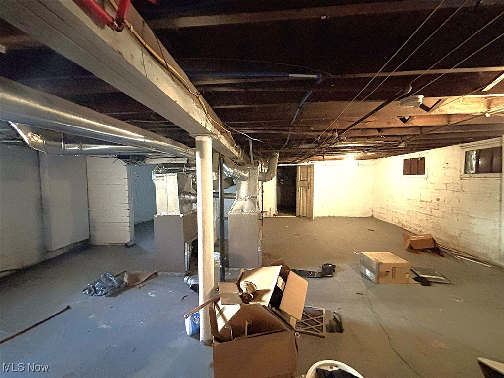 888 Rondel Road Cleveland, OH 44110 - Photo 24 of 35 Unfinished below grade area featuring heating unit