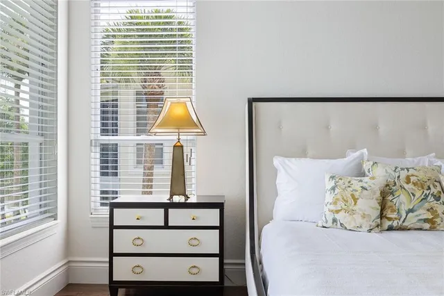 a living room with a bed and a window