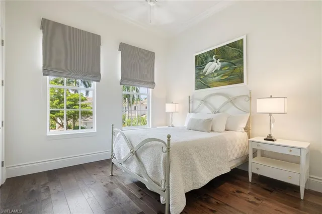 a bedroom with a bed and a desk