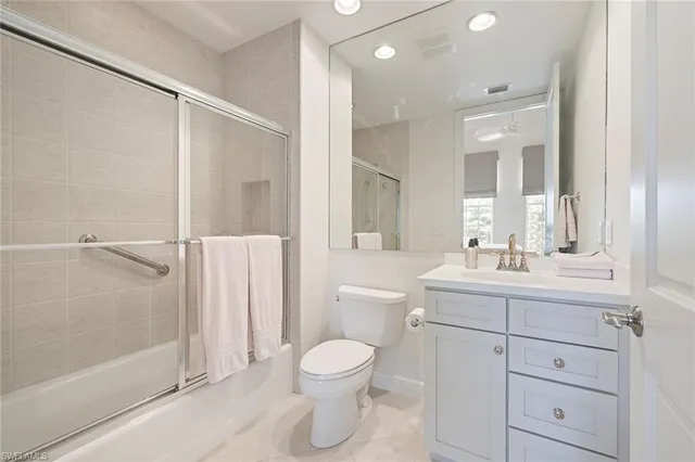 a bathroom with a toilet sink and shower