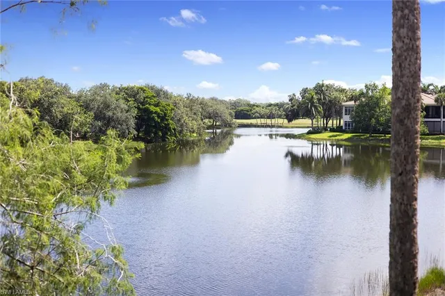 an aerial view of a house with garden space and street view
