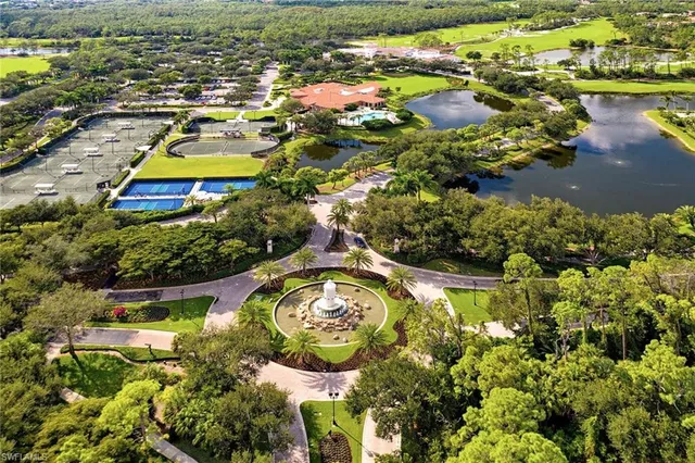 a swimming pool with outdoor seating