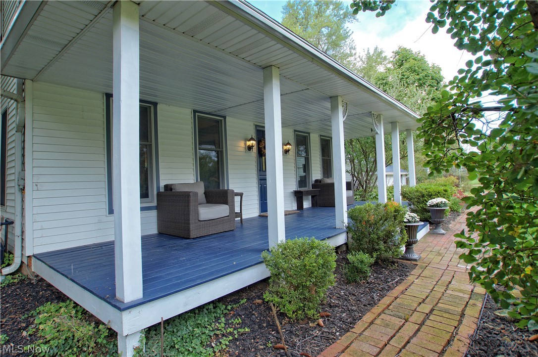12866 Sperry Road Chesterland, OH 44026 - Photo 2 of 33 Brick walkway leads to the Front Porch adding the charm of the times with plenty of room for outdoor furniture and swings.
