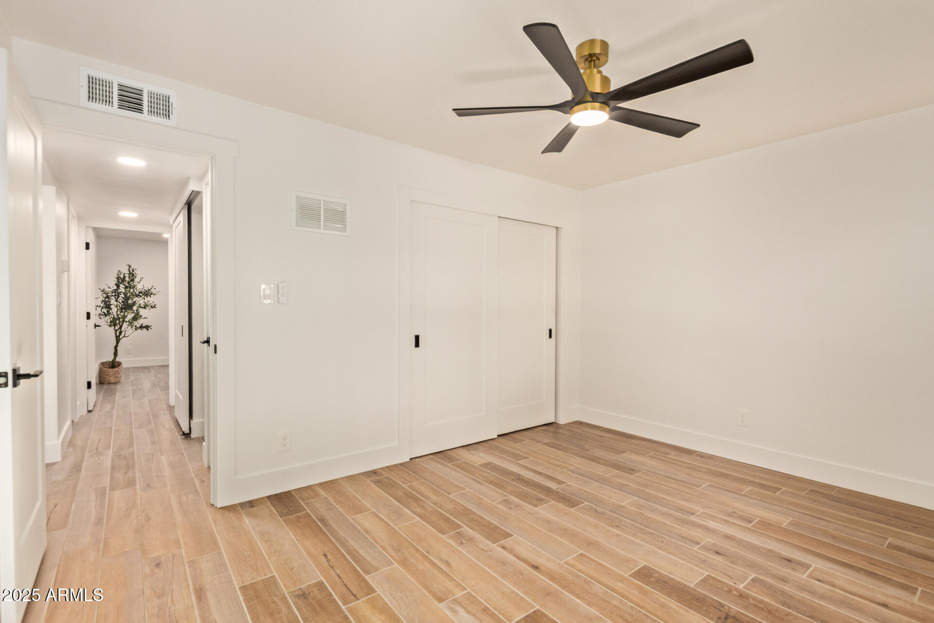 4201 East Camelback Road, Unit 28 Phoenix, AZ 85018 - Photo 13 of 15 wooden floor in an empty room