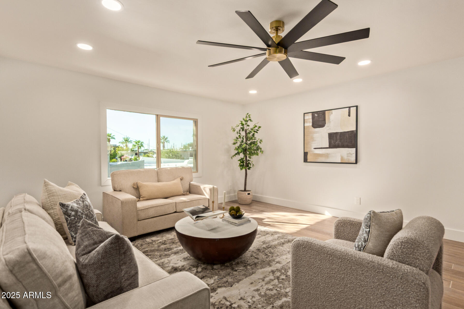 4201 East Camelback Road, Unit 28 Phoenix, AZ 85018 - Photo 4 of 15 a living room with furniture and a large window