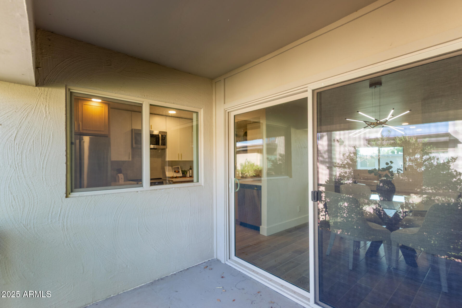 4201 East Camelback Road, Unit 28 Phoenix, AZ 85018 - Photo 8 of 15 a bathroom with a glass shower door and mirror