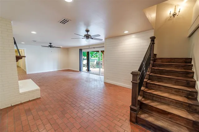 a view of an entryway with wooden floor