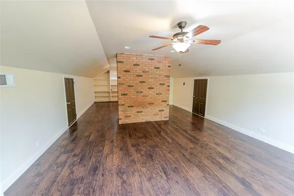 a view of a livingroom with wooden floor