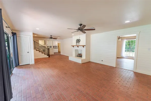 a view of a livingroom with furniture and a window