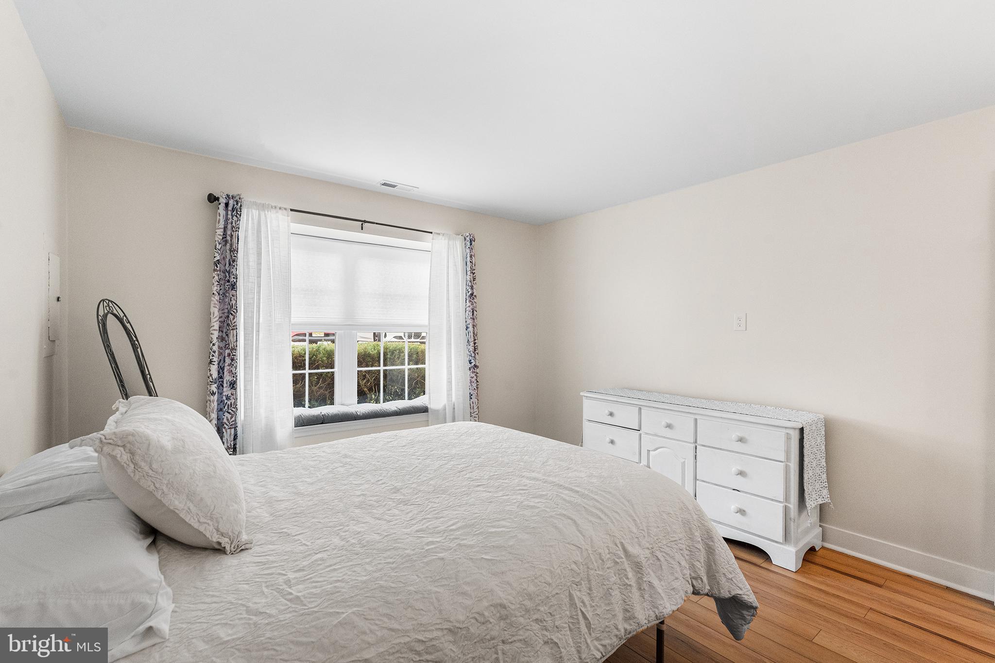 205 Boothby Court Sewell, NJ 08080 - Photo 17 of 21 a bedroom with a bed and a chair