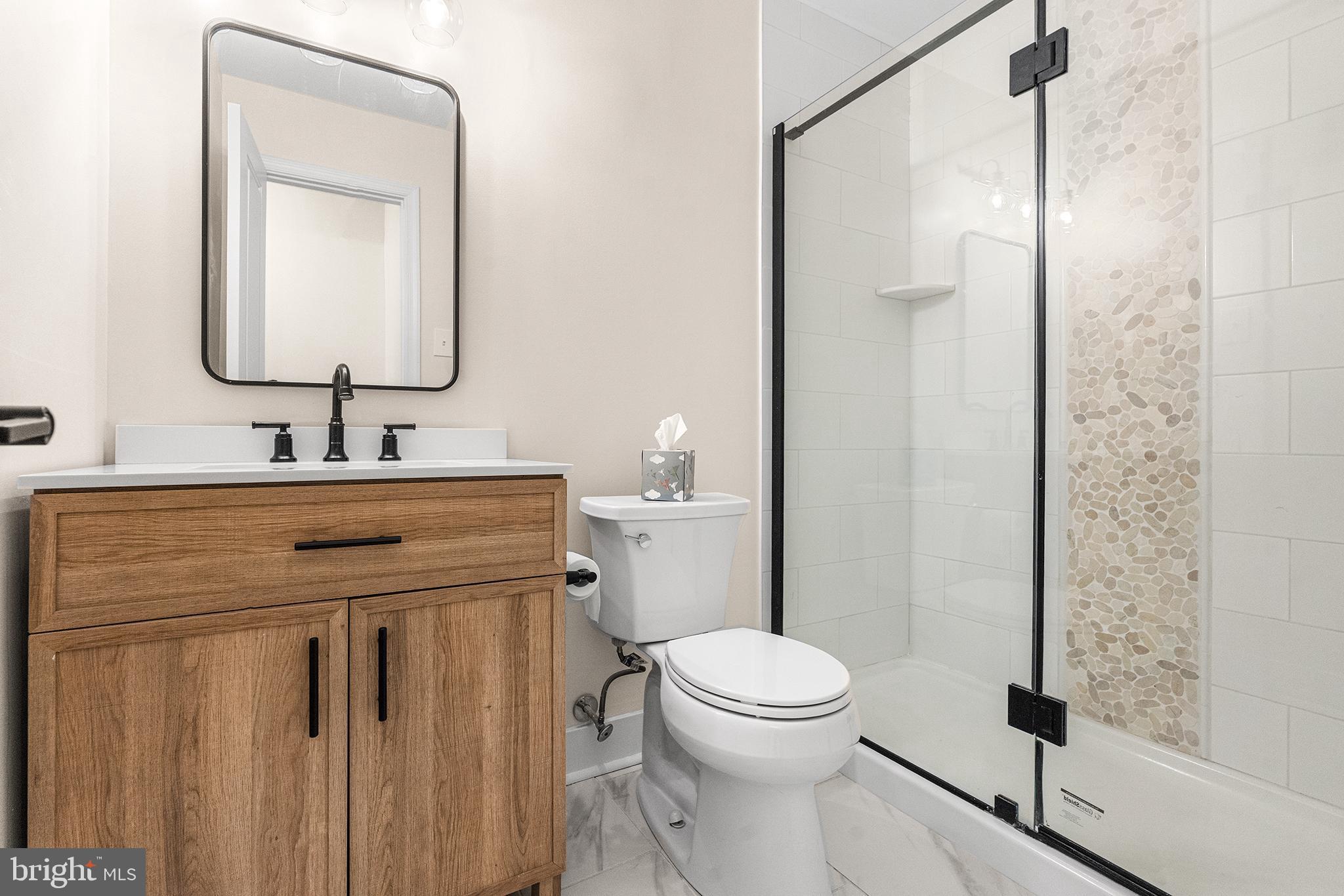 205 Boothby Court Sewell, NJ 08080 - Photo 19 of 21 a bathroom with a toilet sink vanity and shower