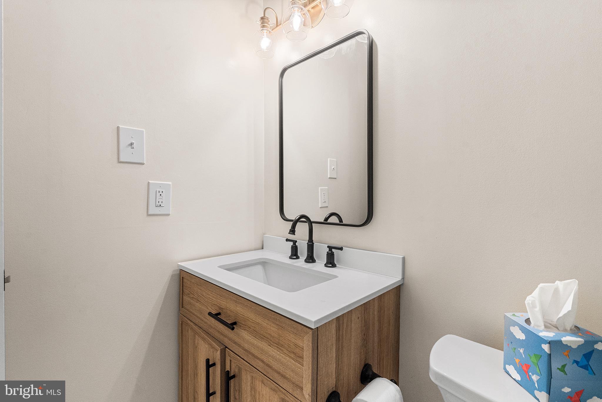 205 Boothby Court Sewell, NJ 08080 - Photo 20 of 21 a bathroom with a sink and a mirror