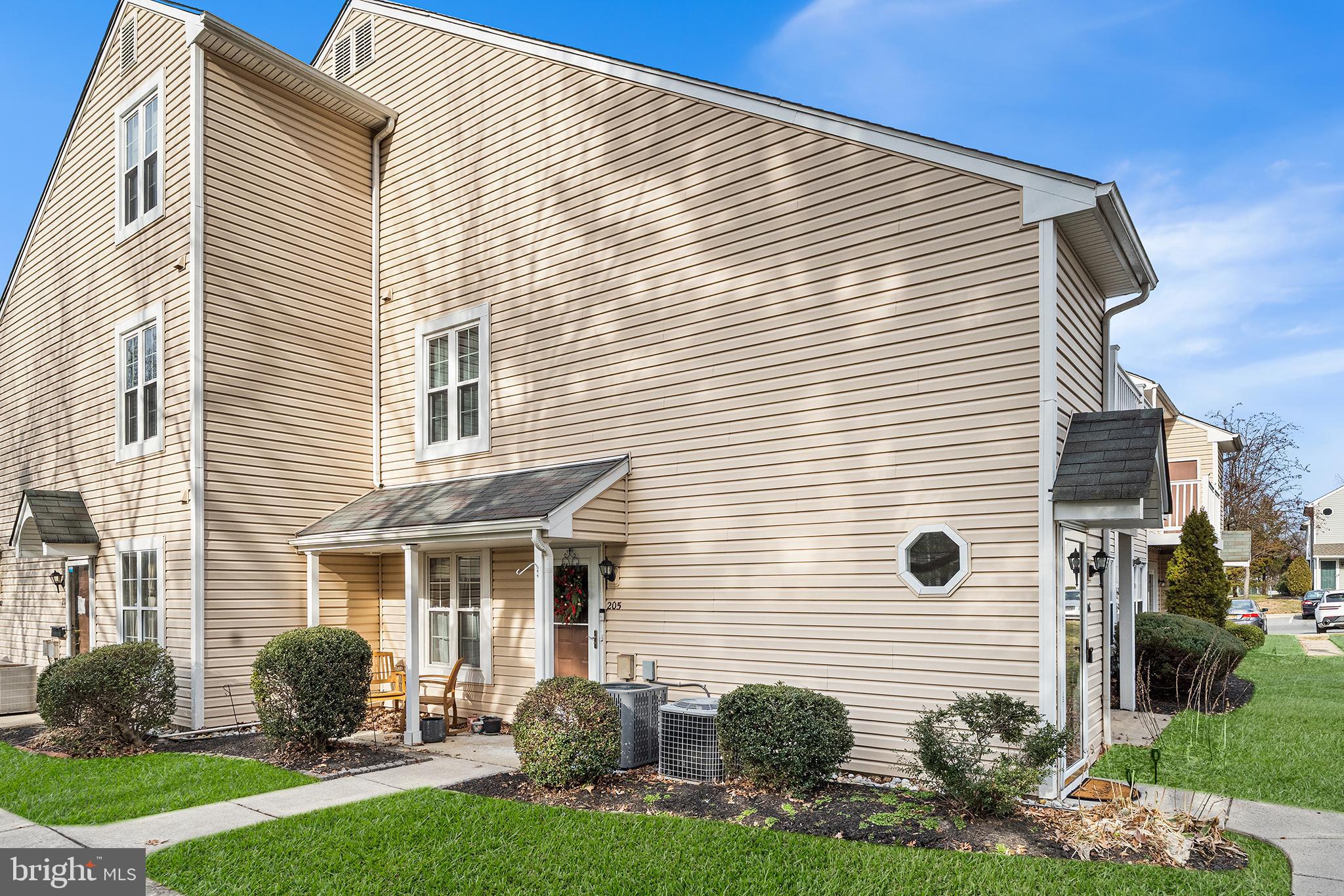 205 Boothby Court Sewell, NJ 08080 - Photo 4 of 21 a front view of a house with a yard and outdoor seating