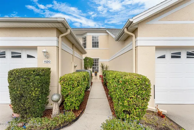 a view of a livingroom with furniture and a potted plant