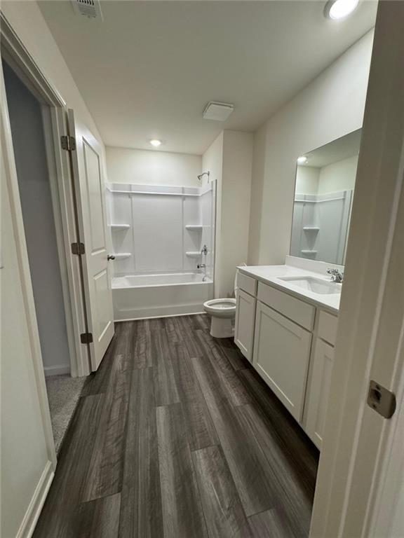 87 Ingleton Drive, Unit 87 Winder, GA 30680 - Photo 7 of 12 a bathroom with a sink a toilet and shower