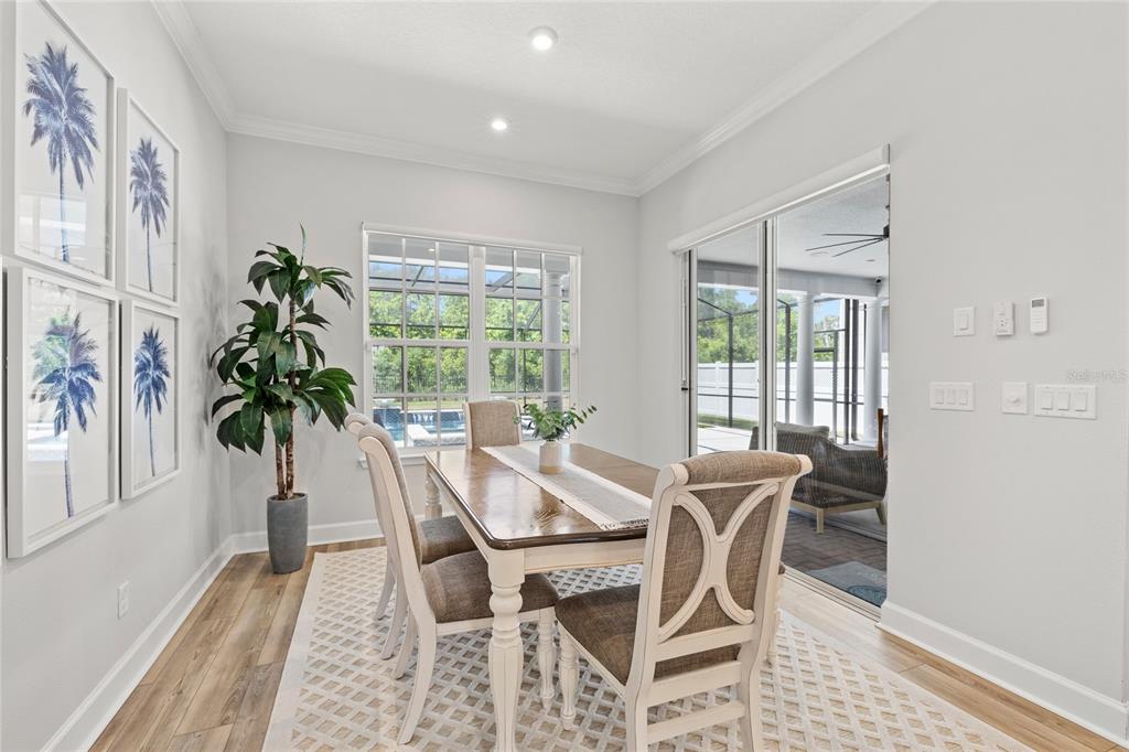 7445 Estuary Lk Loop Kissimmee, FL 34747 - Photo 11 of 54 a view of a dining room with furniture window and outside view