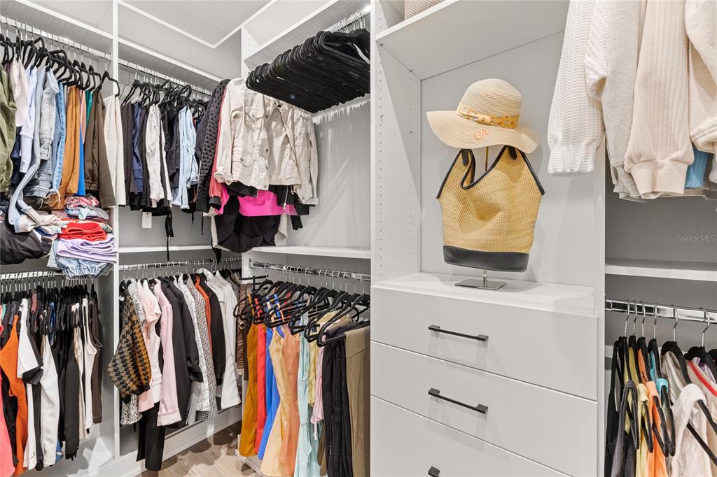 7445 Estuary Lk Loop Kissimmee, FL 34747 - Photo 22 of 54 a view of walk in closet with clothes and shoes