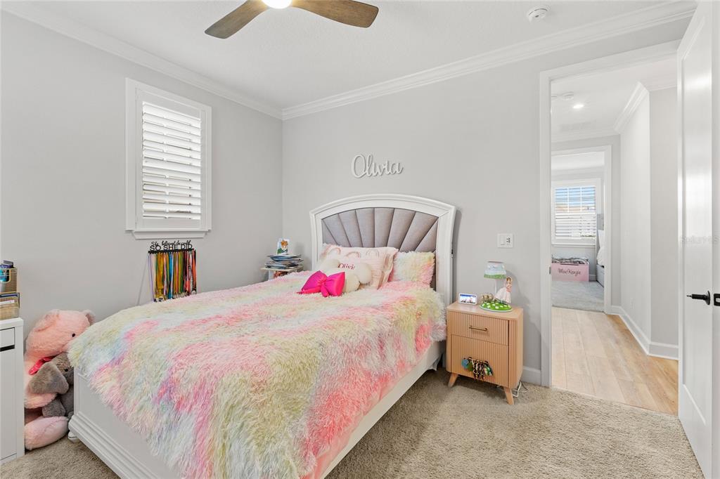 7445 Estuary Lk Loop Kissimmee, FL 34747 - Photo 23 of 54 a bedroom with a bed and a window