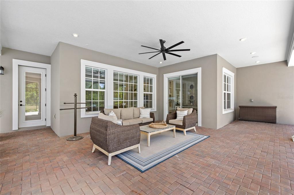 7445 Estuary Lk Loop Kissimmee, FL 34747 - Photo 34 of 54 a living room with furniture and a large window