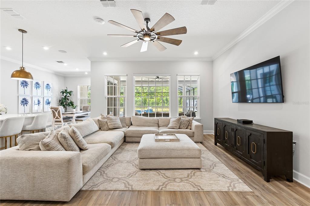 7445 Estuary Lk Loop Kissimmee, FL 34747 - Photo 5 of 54 a living room with furniture and a large window