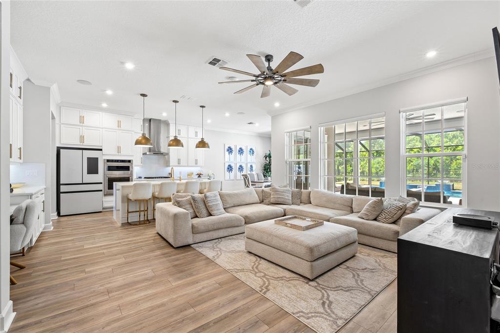 7445 Estuary Lk Loop Kissimmee, FL 34747 - Photo 6 of 54 a living room with furniture and a large window