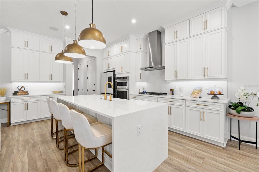 7445 Estuary Lk Loop Kissimmee, FL 34747 - Photo 8 of 54 a kitchen with white cabinets and white appliances