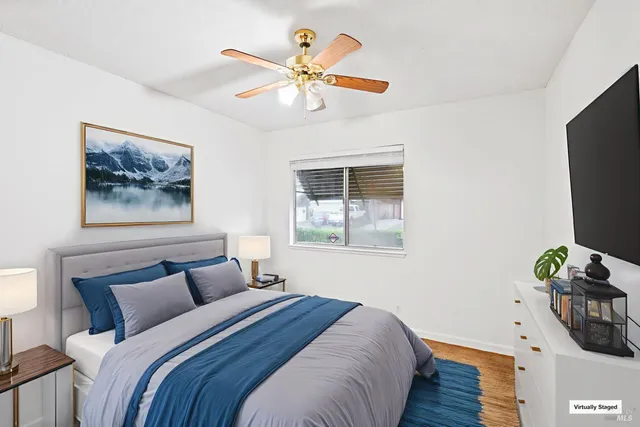 a bedroom with a bed and a window