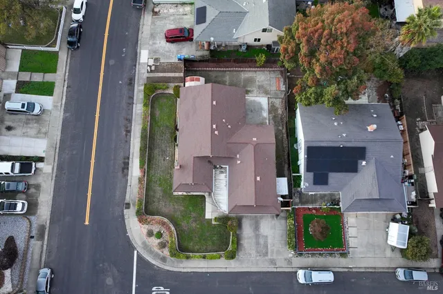 an aerial view of a house with outdoor space
