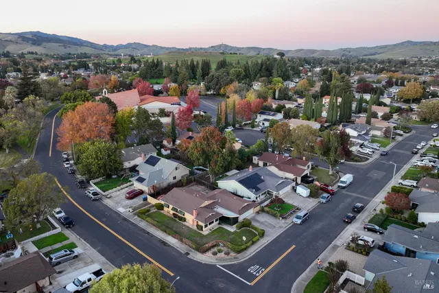 an aerial view of residential houses with outdoor space