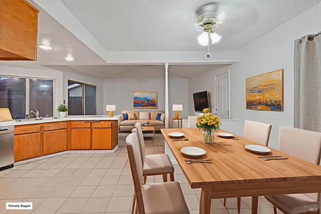 a view of a dining room with furniture and a chandelier