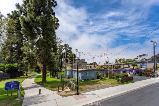 a view of a park with swings and slides