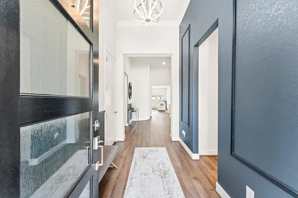 a view of a hallway with front door