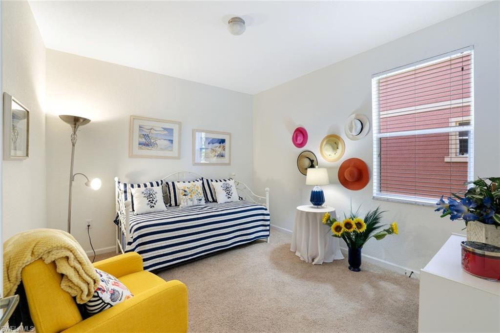 10049 Heather Lane, Unit 101 Naples, FL 34119 - Photo 22 of 28 Bedroom featuring carpet and baseboards