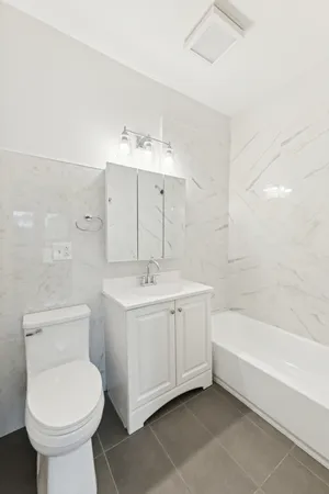a bathroom with a sink toilet and bathtub