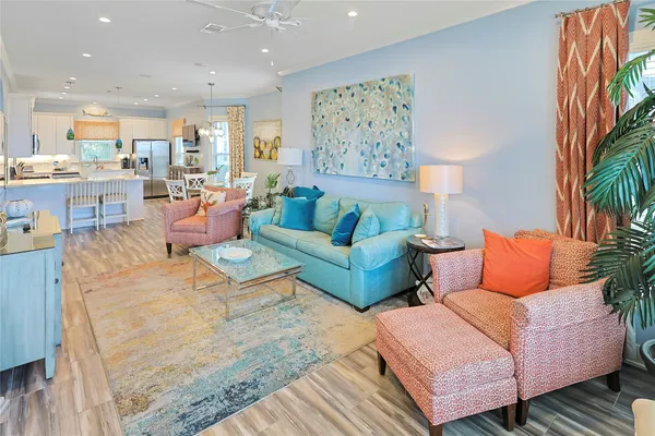 a living room with furniture and a painting