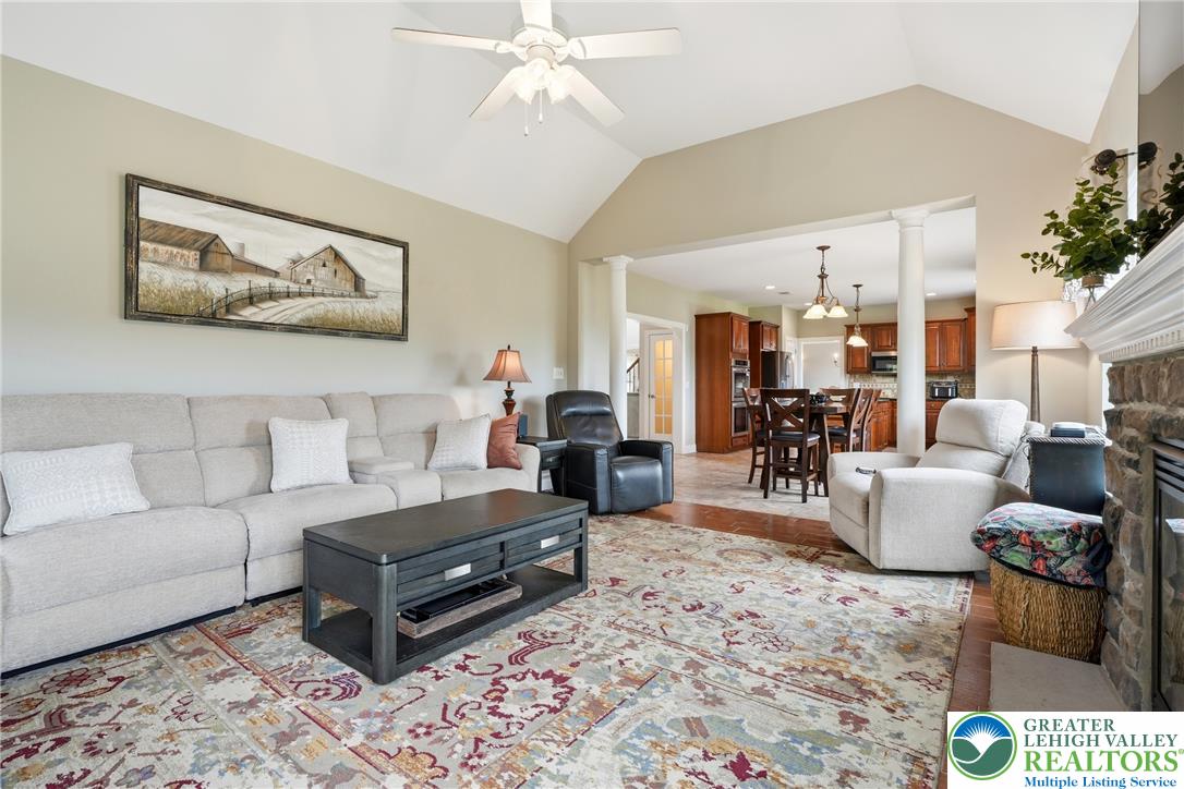 245 East Dell Road Bath, PA 18014 - Photo 25 of 99 A vaulted ceiling living area flows seamlessly into a well-appointed kitchen, ideal for entertaining.