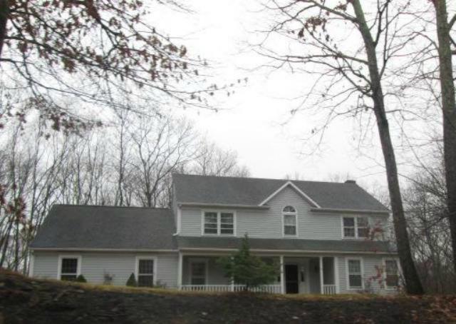4 Fawnwood Road Newtown, CT 06482 - Photo 1 of 1 front view of house with a trees