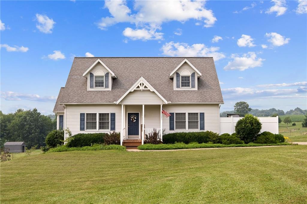 116 Country Lane Road Butler, PA 16001 - Photo 2 of 50 a front view of a house with a garden