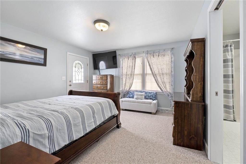 116 Country Lane Road Butler, PA 16001 - Photo 21 of 50 a bedroom with a bed couch and a window