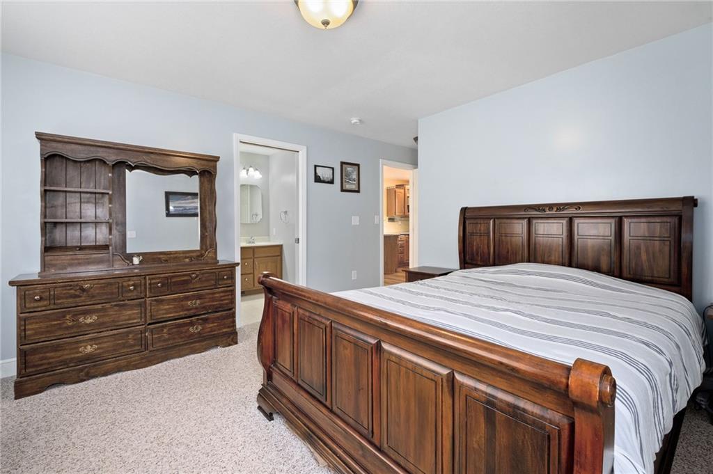 116 Country Lane Road Butler, PA 16001 - Photo 22 of 50 a bedroom with a bed and a dresser
